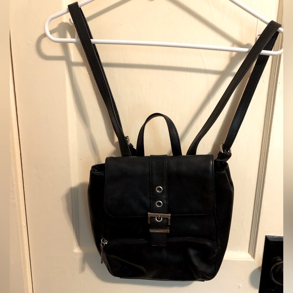 Genuine leather black backpack with front and back pockets in outside
